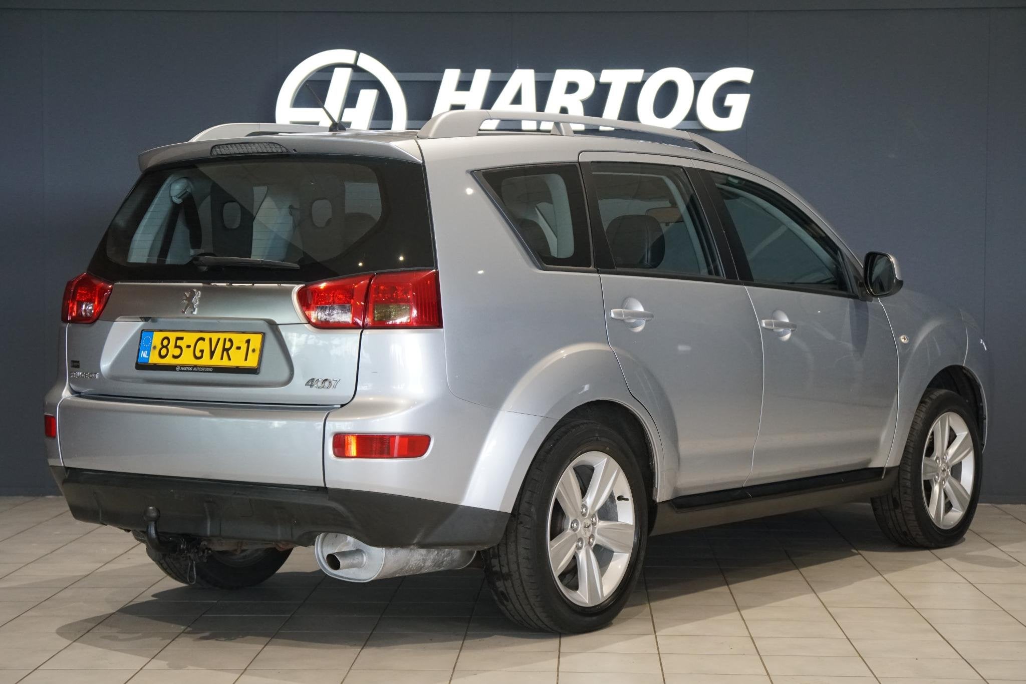 Peugeot 4007 2.4 ST 7p. + 4WD / TREKHAAK / NAVIGATIE / CRUIS, Auto's, Peugeot, Stof, Gebruikt, 4 cilinders, Bedrijf