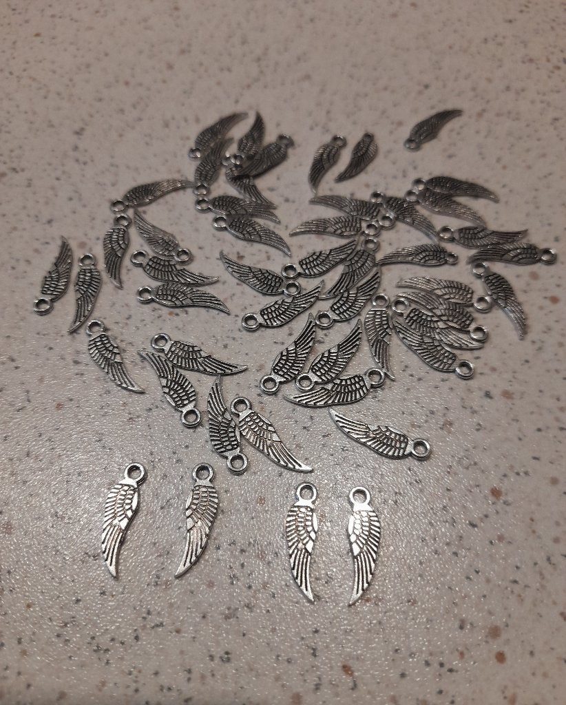 Metalen vleugel bedel, Hobby en Vrije tijd, Kralen en Sieraden maken, Ophalen of Verzenden, Nieuw, Bedel