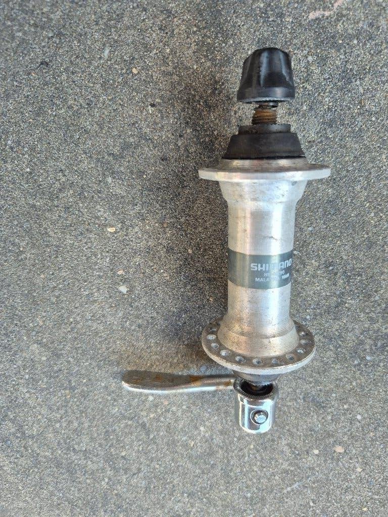 Shimano voorwiel steekas met snelspanner, Ophalen of Verzenden