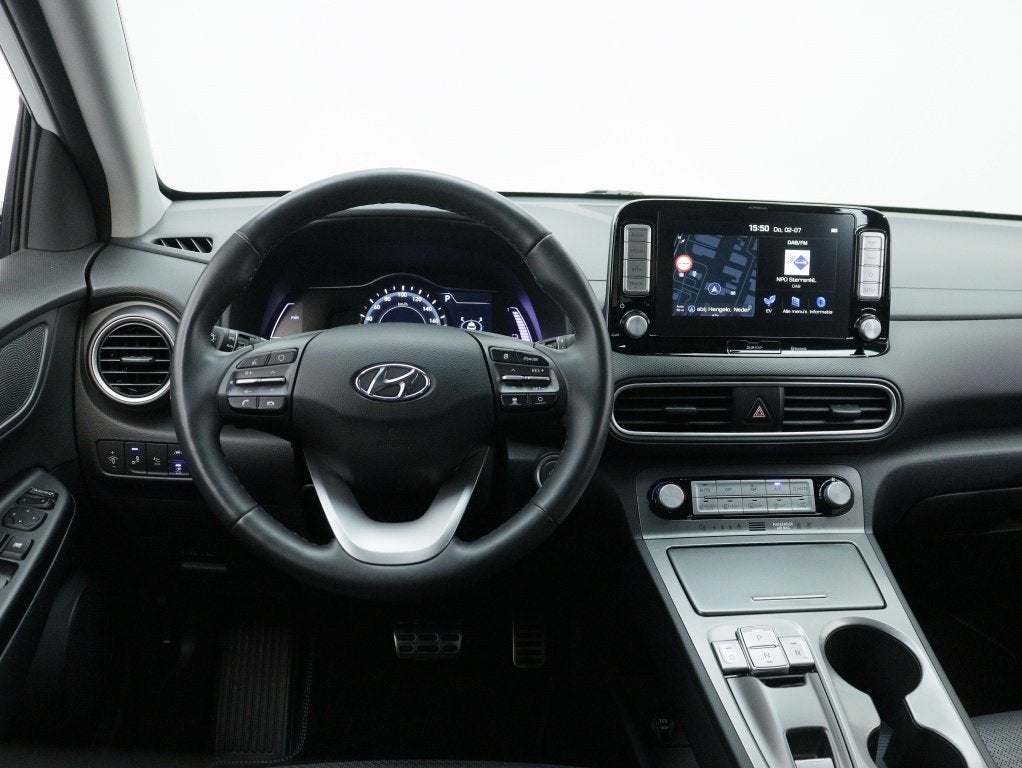 Hyundai KONA EV 64kWh Premium | SOH 100% | Stoelverwarming |, 12 maanden, 0 cilinders, Gebruikt, Zwart