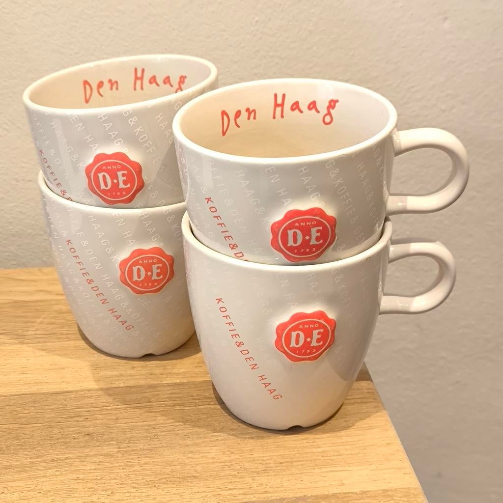 4x Douwe Egberts Den Haag Kopjes voor koffie/thee, Ophalen of Verzenden, Gebruikt, Overige stijlen, Kop(pen) en/of Schotel(s)
