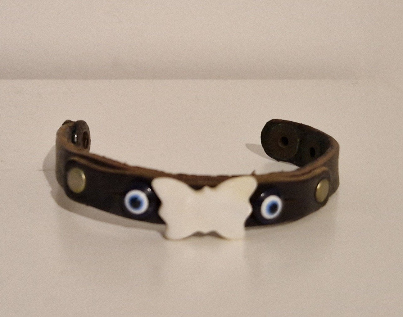 Armband bruin vlinder leer drukker sieraden blauwe oog, Sieraden, Tassen en Uiterlijk, Gebruikt, Bruin, Verzenden, Leer