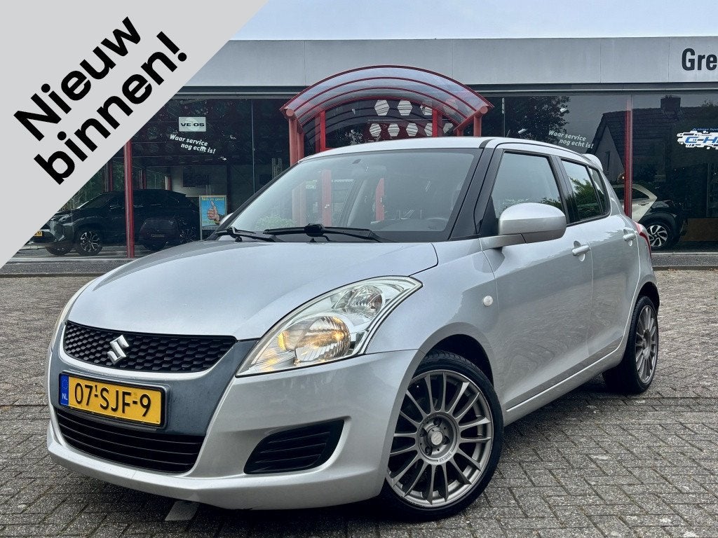 Suzuki Swift 1.2 Comfort EASSS | Airco | Stoelverwarming | 1, Auto's, Suzuki, Stof, Gebruikt, 4 cilinders, 400 kg