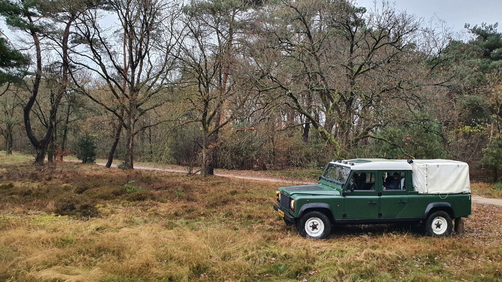 Land Rover Defender 130 300 TDI grijs kenteken 1998, Auto's, 4x4, Stof, Land Rover, 4 cilinders