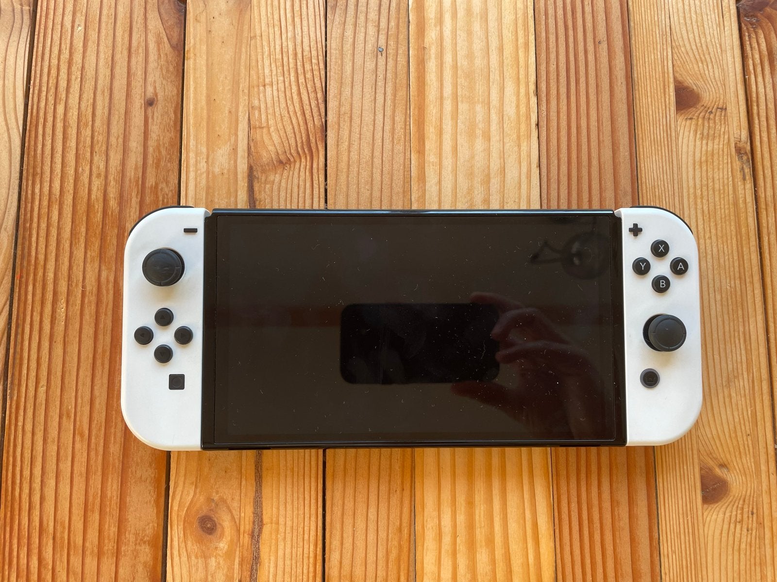 Nintendo Switch OLED met accessoires en game