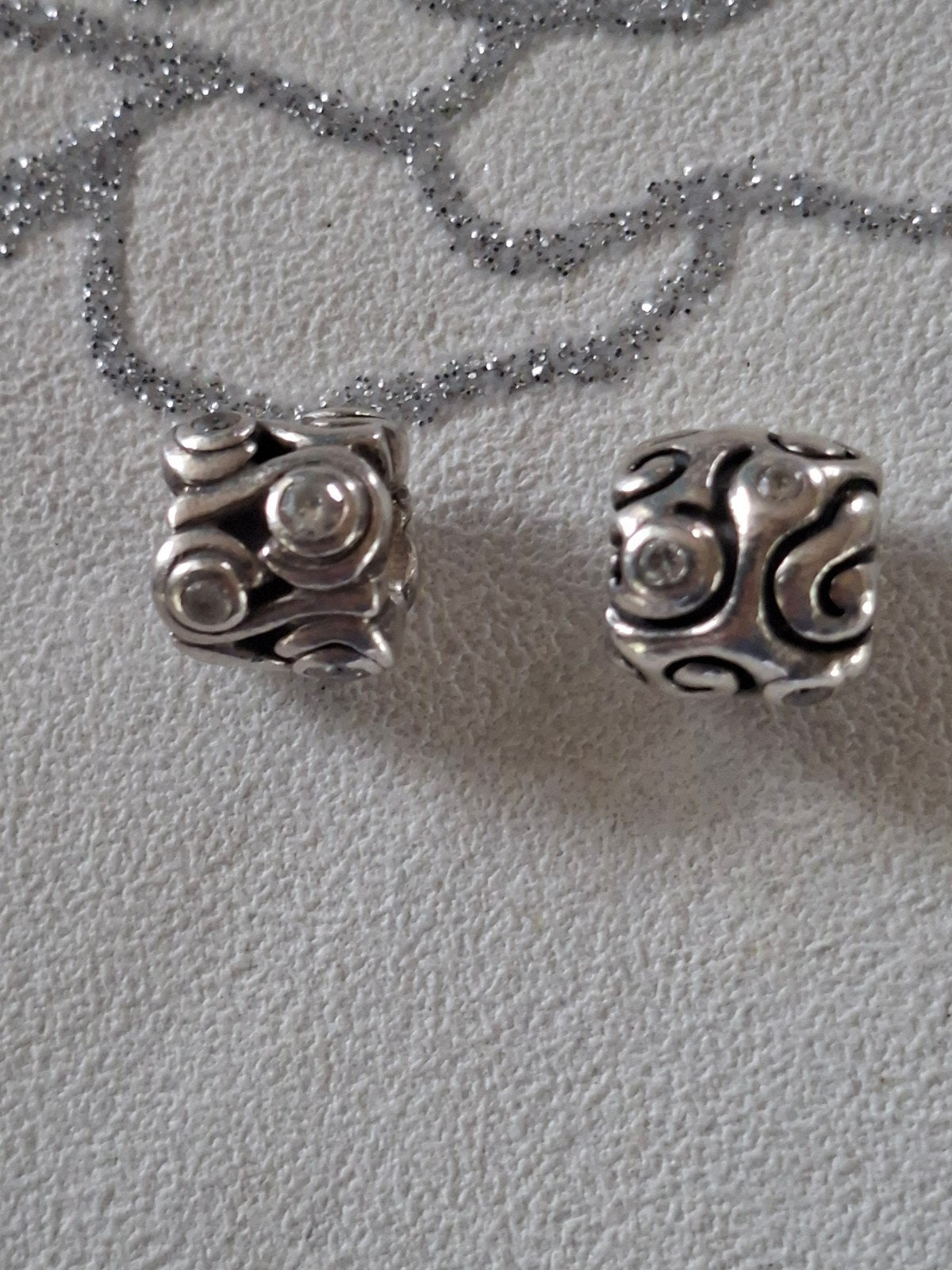 Pandora golven en dromen met zirkonia's. Collectors items, Sieraden, Tassen en Uiterlijk, Bedels, Gebruikt, Verzenden, 2 of 3 bedels