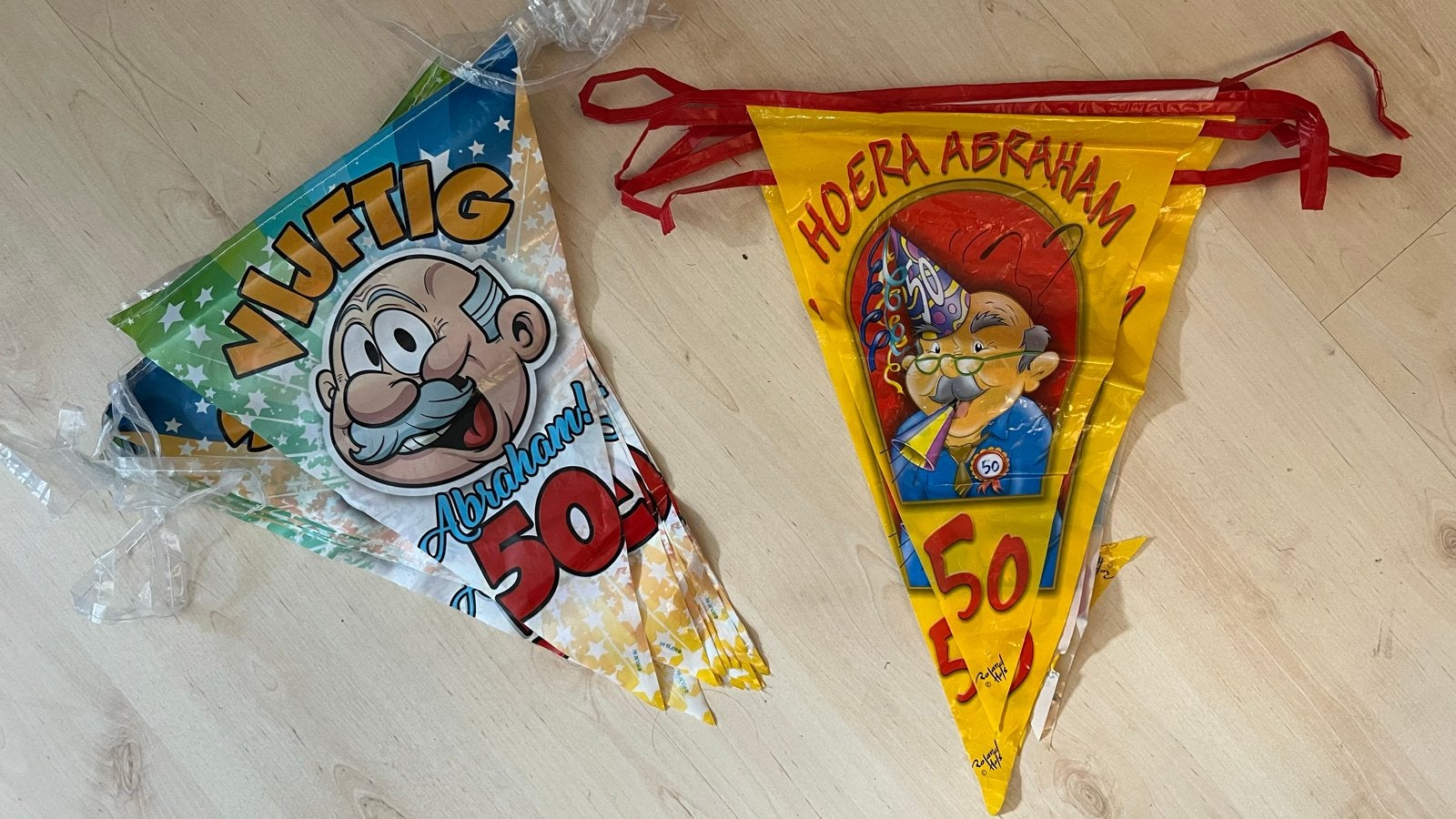 2x Abraham 50 jaar slingers, Ophalen of Verzenden, Gebruikt, Versiering, Abraham of Sarah