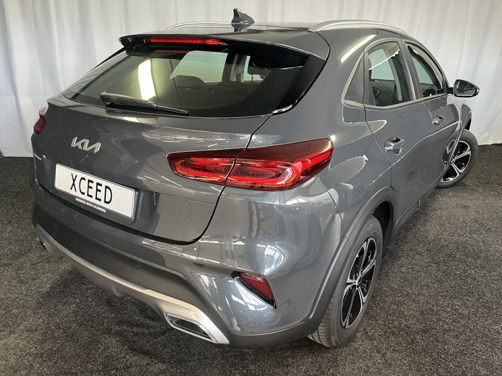 Kia Xceed 1.6 GDi PHEV PLUG-IN DynamicLine 1E EIGN/ECC/APPLE, Auto's, Stof, Gebruikt, Met garantie (alle), Plug-in hybride