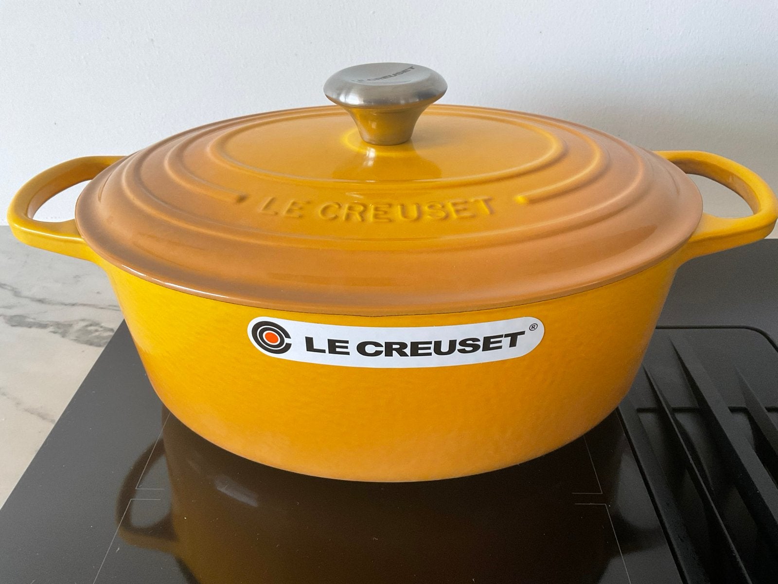 Le Creuset 29 cm ovale pan, nectar geel, 4,7 lt, nieuw, Gietijzer, Nieuw, Ophalen of Verzenden, Keramische plaat