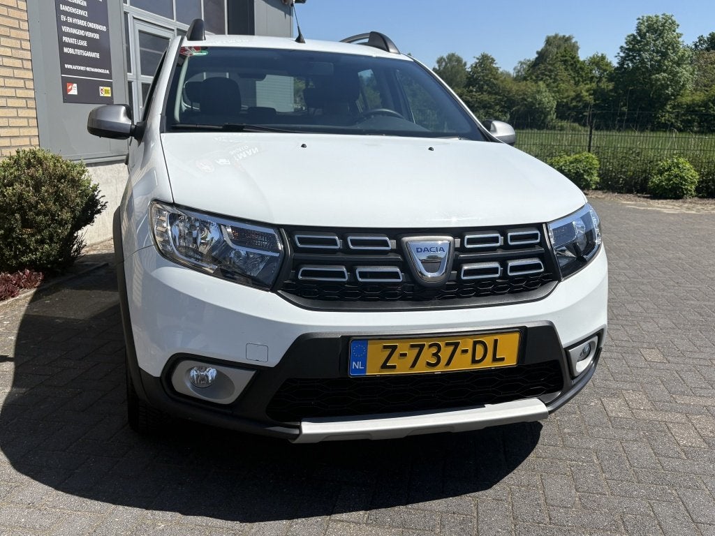 Dacia Sandero 0.9 TCe Tech Road STOELVERW-NAVI-BT - Onderhou, Auto's, Keurmerk '100% Onderhouden', Euro 6, Wit, Bedrijf