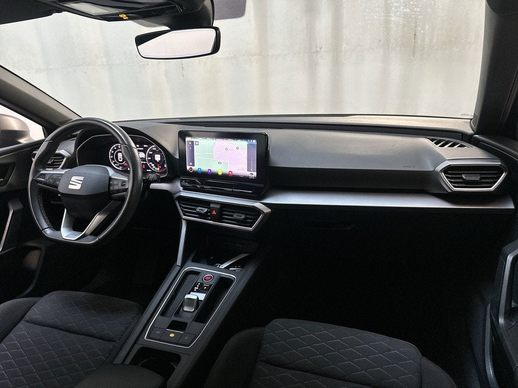 Seat Leon Sportstourer 1.5 eTSI 150pk DSG FR Business Intens, Auto's, Seat, Stof, 4 cilinders, Leon, Zwart