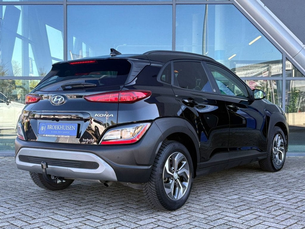 Hyundai Kona 1.6 GDI HEV Comfort Smart 141pk Camera / Trekha, Auto's, Stof, Gebruikt, Zwart, Bedrijf