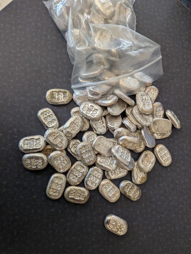 Zilver 50x 10 gram crossbones te koop 999 zilver. €1300, Ophalen of Verzenden, Zilver