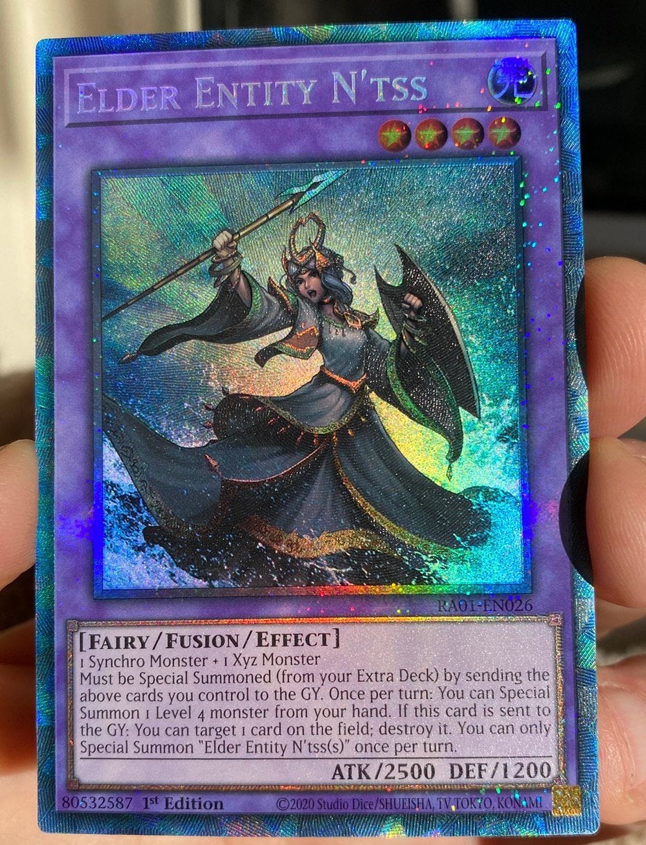 Yu-Gi-Oh! Elder Entity N'tss RA01 1st Edition Collectors !, Ophalen of Verzenden, Zo goed als nieuw, Losse kaart, Foil