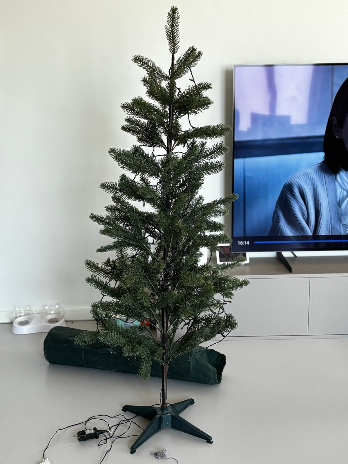 Kunstkerstboom met opberghoes, Ophalen