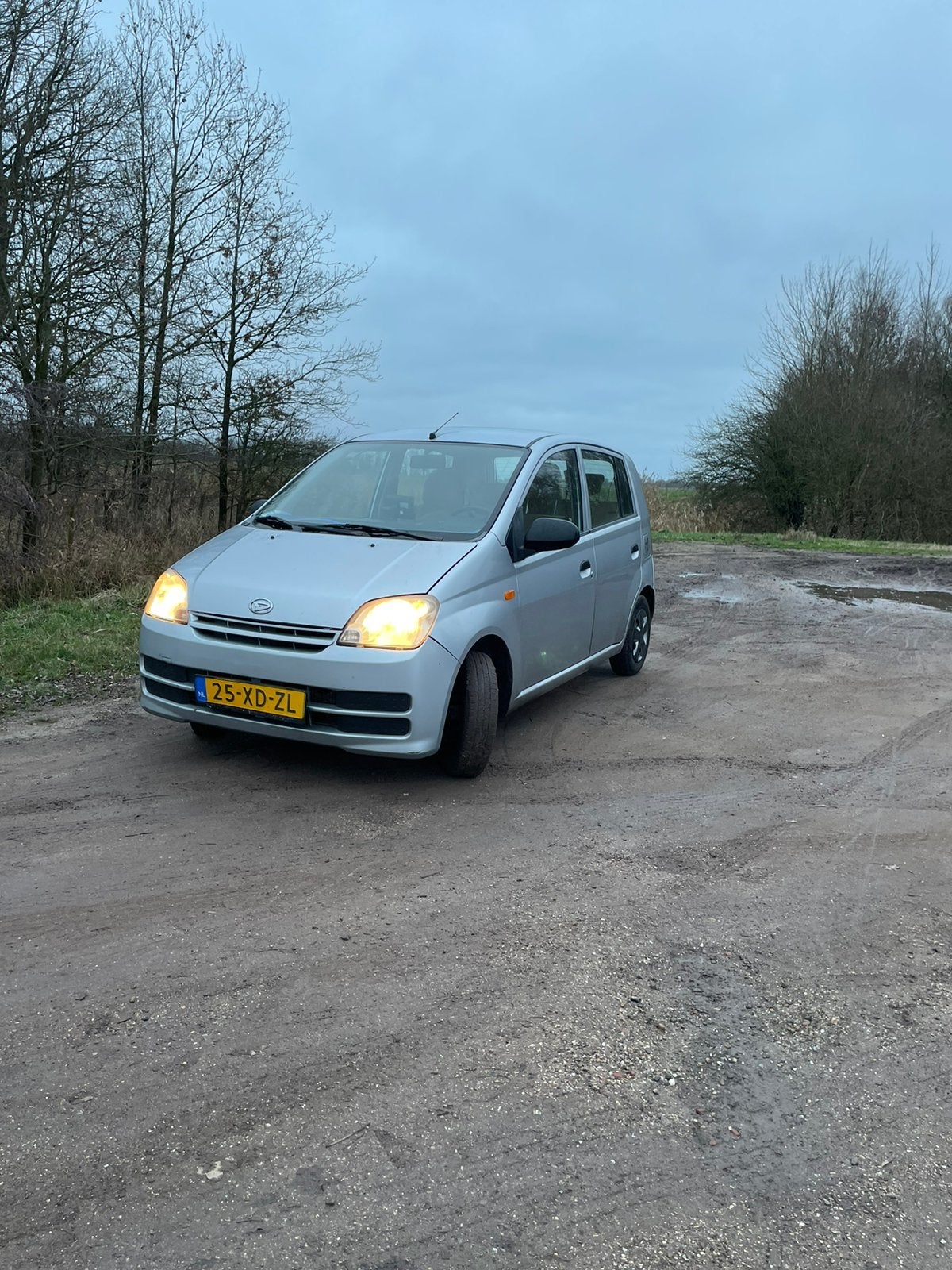 Daihatsu Cuore 1.0 5D 2007 Grijs (63000km), Auto's, Stof, 600 kg, Beige, 18 €/maand