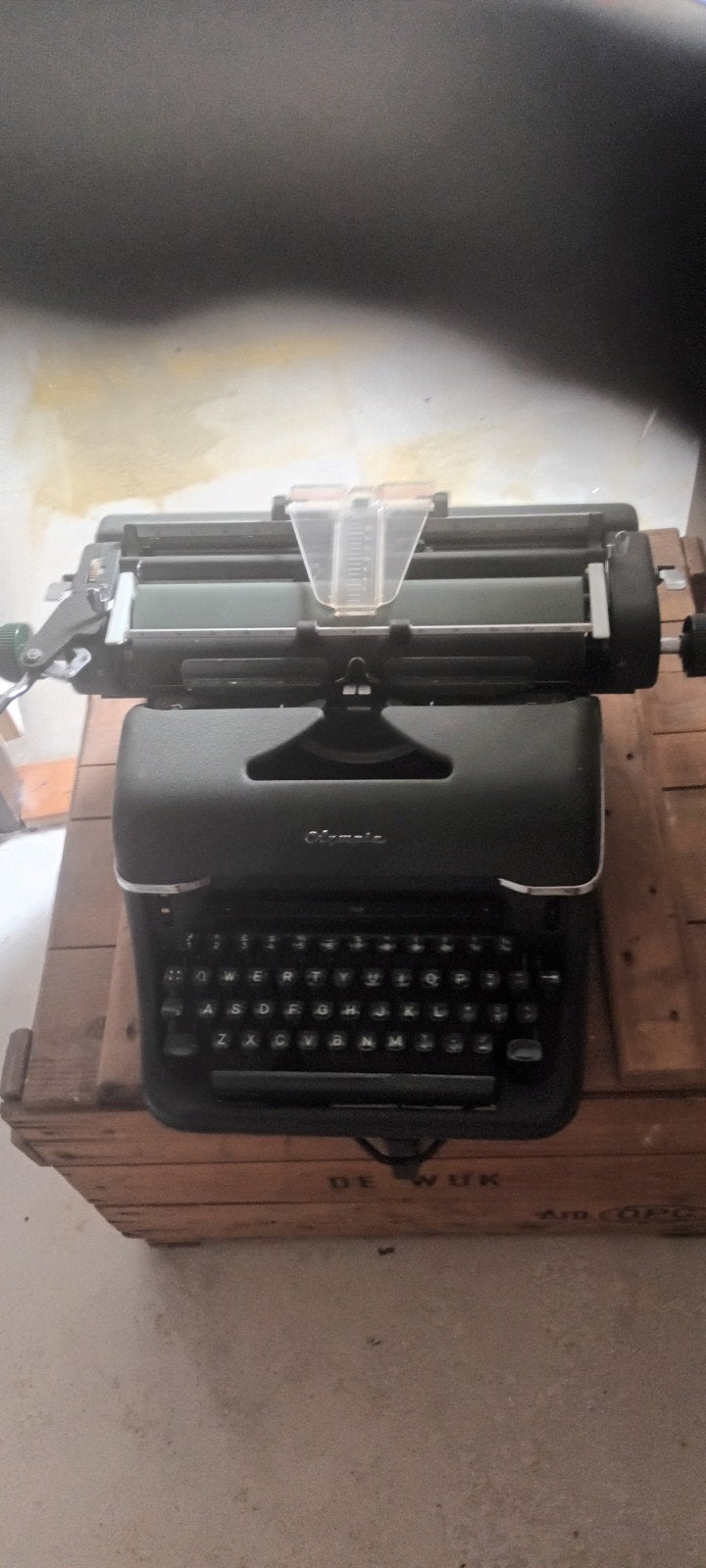 olympiade schrijfmachine, Ophalen