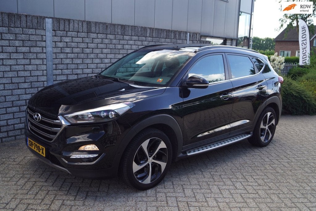 Hyundai Tucson 1.6 T-GDi Premium 4WD Autom Panodak Leder Spo, Auto's, Hyundai, Gebruikt, 4 cilinders, Zwart, Leder