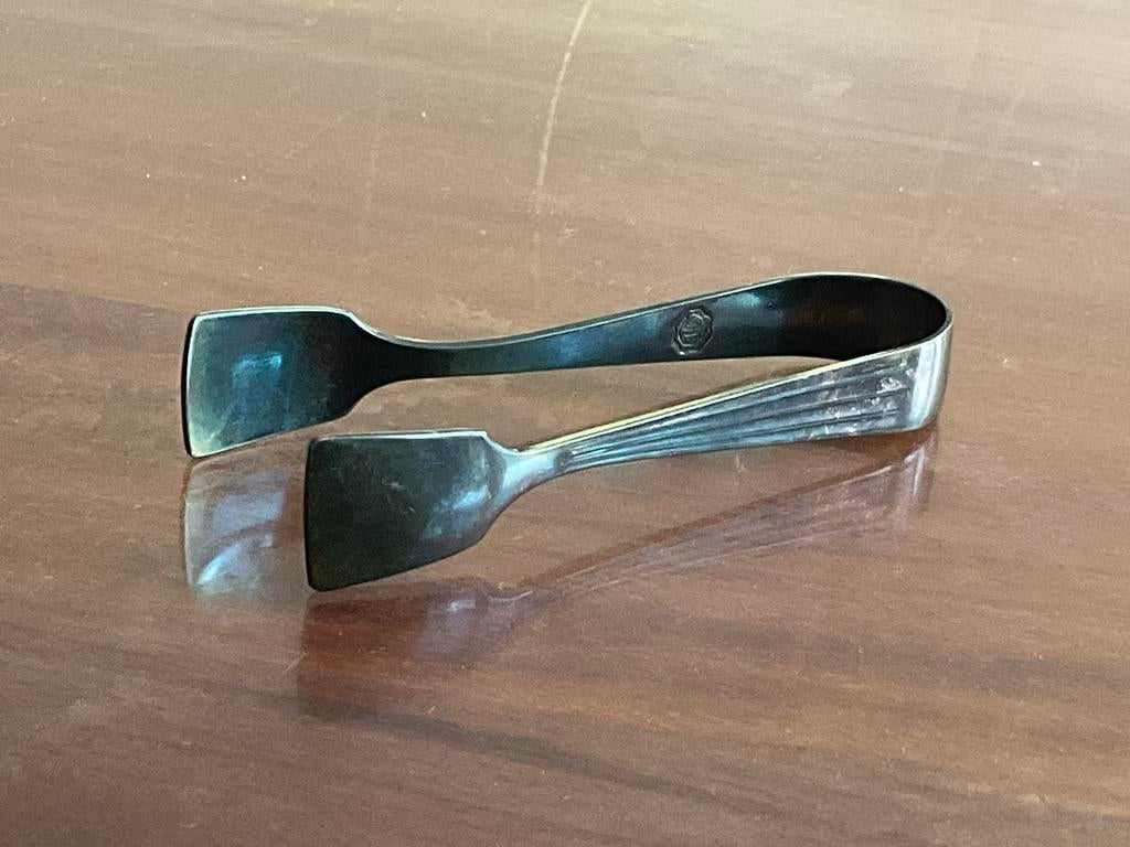 Verzilverde suikertang model Ampire van DE Douwe Egberts, Antiek en Kunst, Ophalen of Verzenden