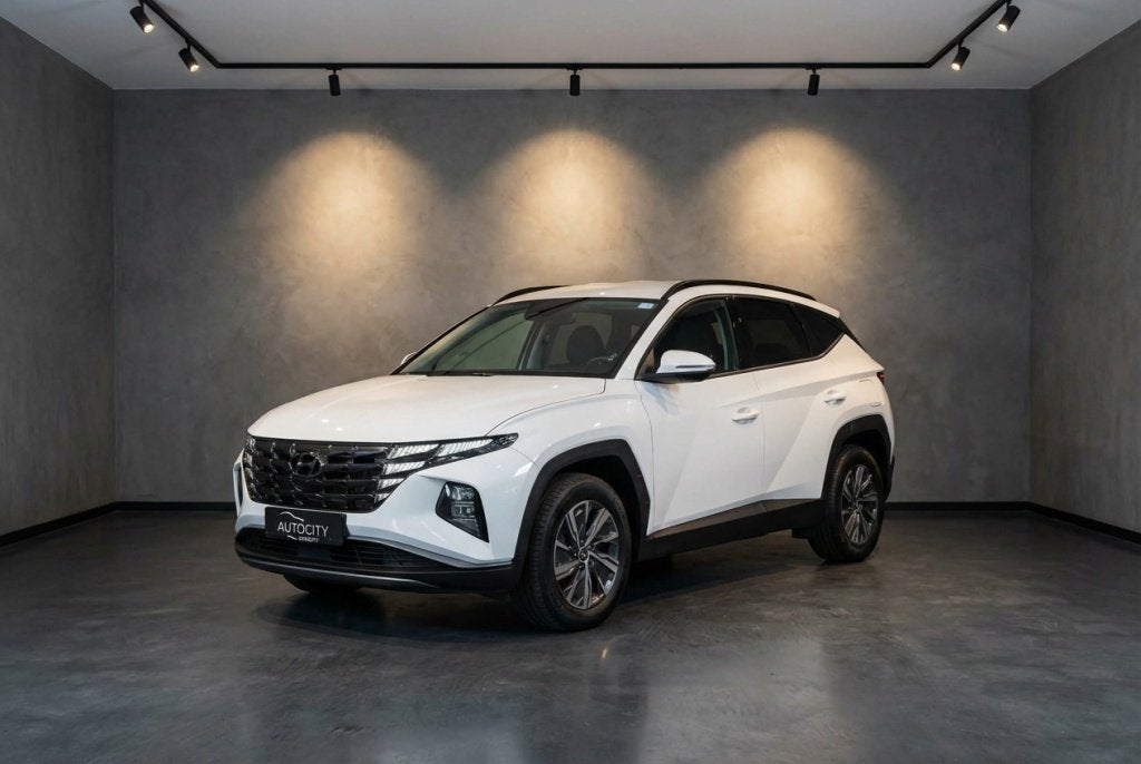 Hyundai Tucson 1.6 T-GDI HEV Comfort | Carplay | Camera | Ad, Auto's, Gebruikt, 4 cilinders, Wit, Bedrijf