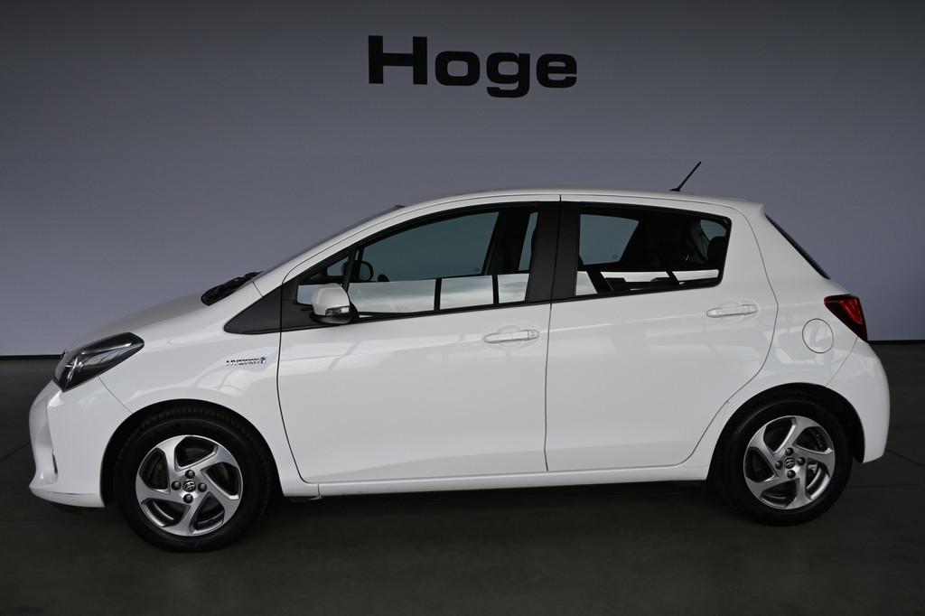 Toyota Yaris 1.5 Hybrid Trend Bi-Tone Clima Navigatie Trekha, Gebruikt, 4 cilinders, Bedrijf, Hybride Elektrisch/Benzine