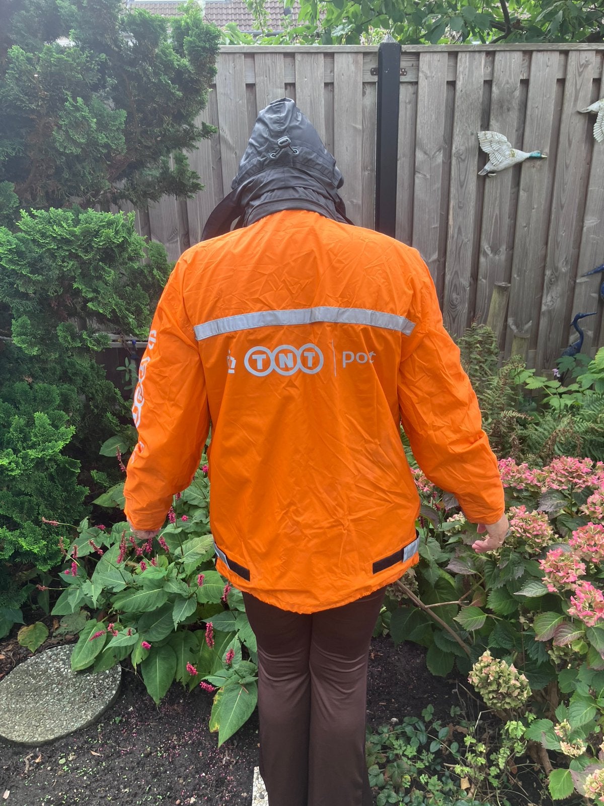 Regenjas TNT  maat S, Kleding | Dames, Jassen | Winter, Ophalen of Verzenden, Zo goed als nieuw, Oranje