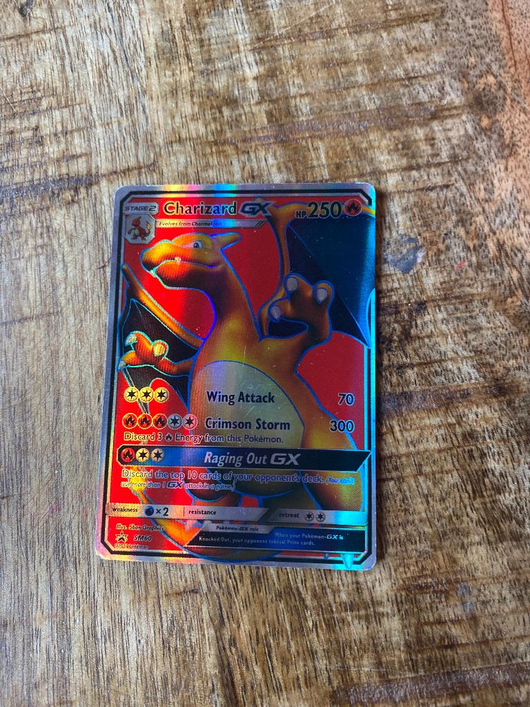 Pokemon charizard SM 60, Ophalen of Verzenden, Zo goed als nieuw, Losse kaart