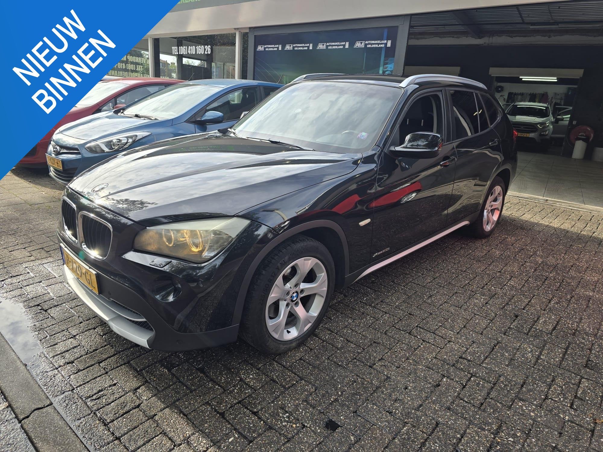 BMW X1 xDrive20i Business, Auto's, Stof, Gebruikt, 4 cilinders, 2000 kg