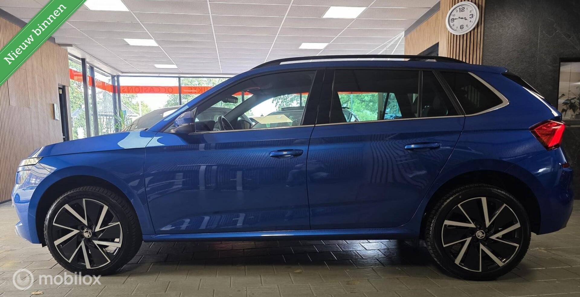 Skoda Kamiq 1.0 TSI Sport Business/ Panorama dak / Achteruit, Gebruikt, Euro 6, Blauw, 49 €/maand