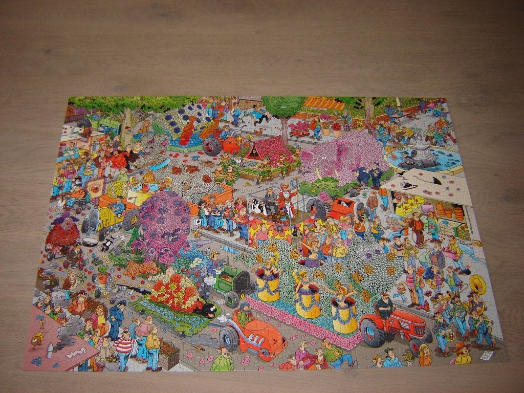 Puzzel Jan van Haasteren DE BLOEMENCORSO 1000 st., Ophalen of Verzenden, 500 t/m 1500 stukjes, Zo goed als nieuw, Legpuzzel