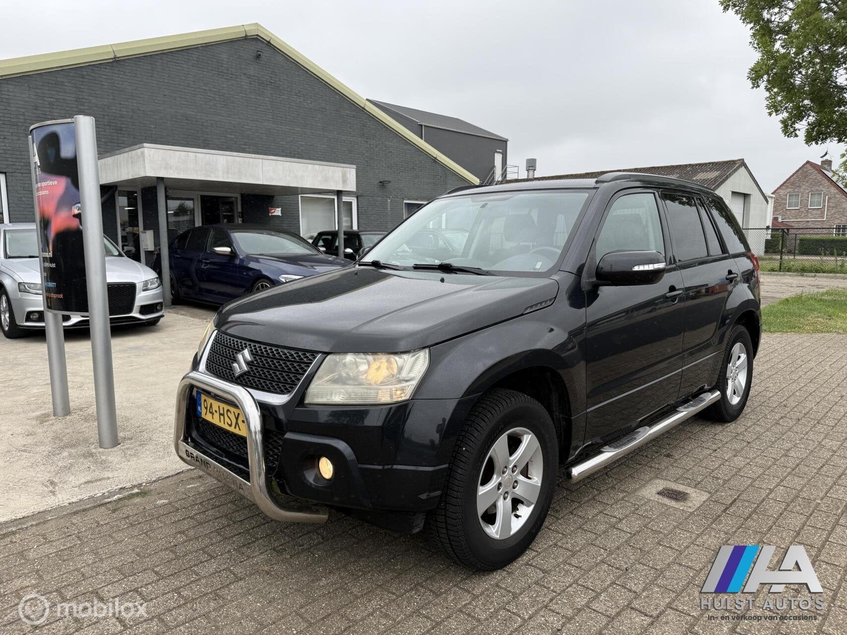 Suzuki Grand Vitara 2.0-16V Exclusive 4x4 2009 | Bull & Side, Stof, 4 cilinders, 1850 kg, Grand Vitara