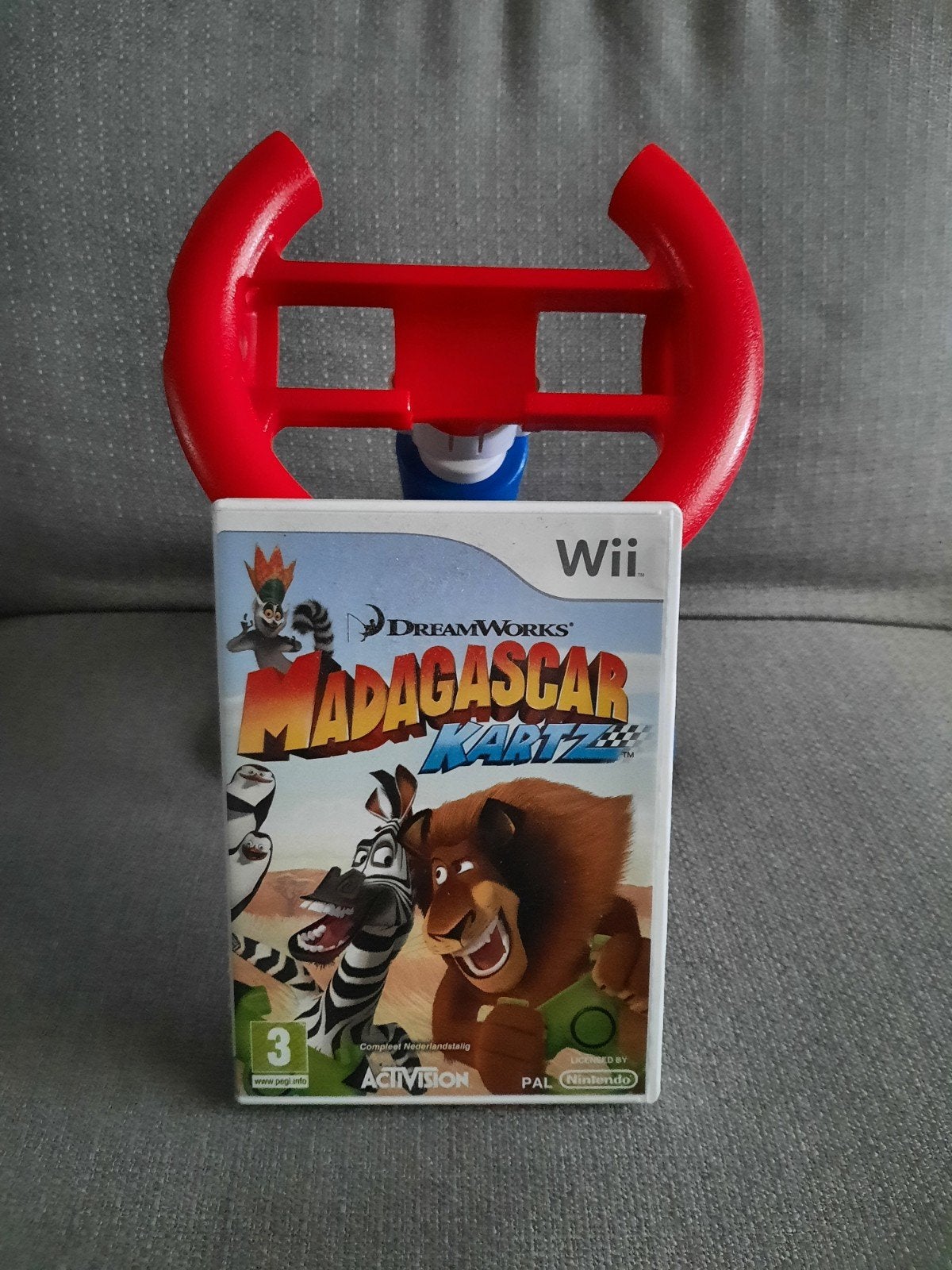 Wii Madagascar Kartz incl. Wii racing wheel,, Spelcomputers en Games, Gebruikt, 1 speler, Racen en Vliegen, Ophalen of Verzenden