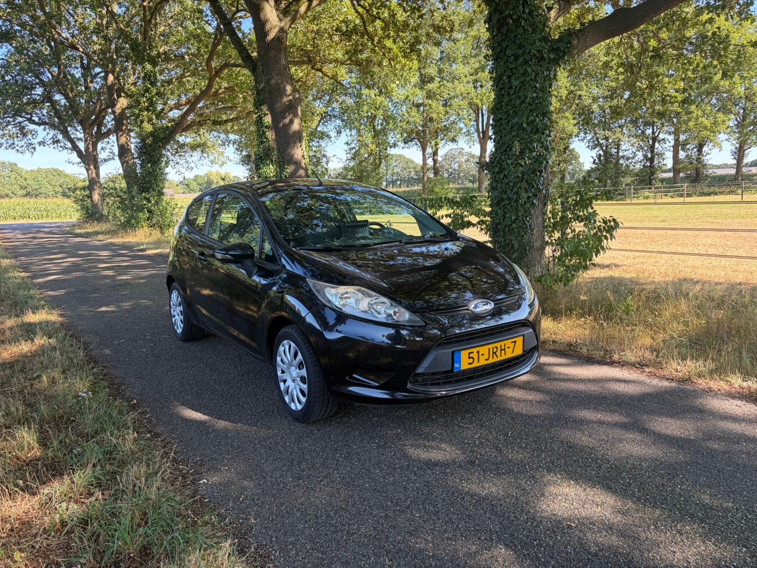 Ford Fiësta 1.25 44KW 3DR 2009 Zwart, NWE distributie, Airco, Voorwielaandrijving, 4 cilinders, Bluetooth, Zwart