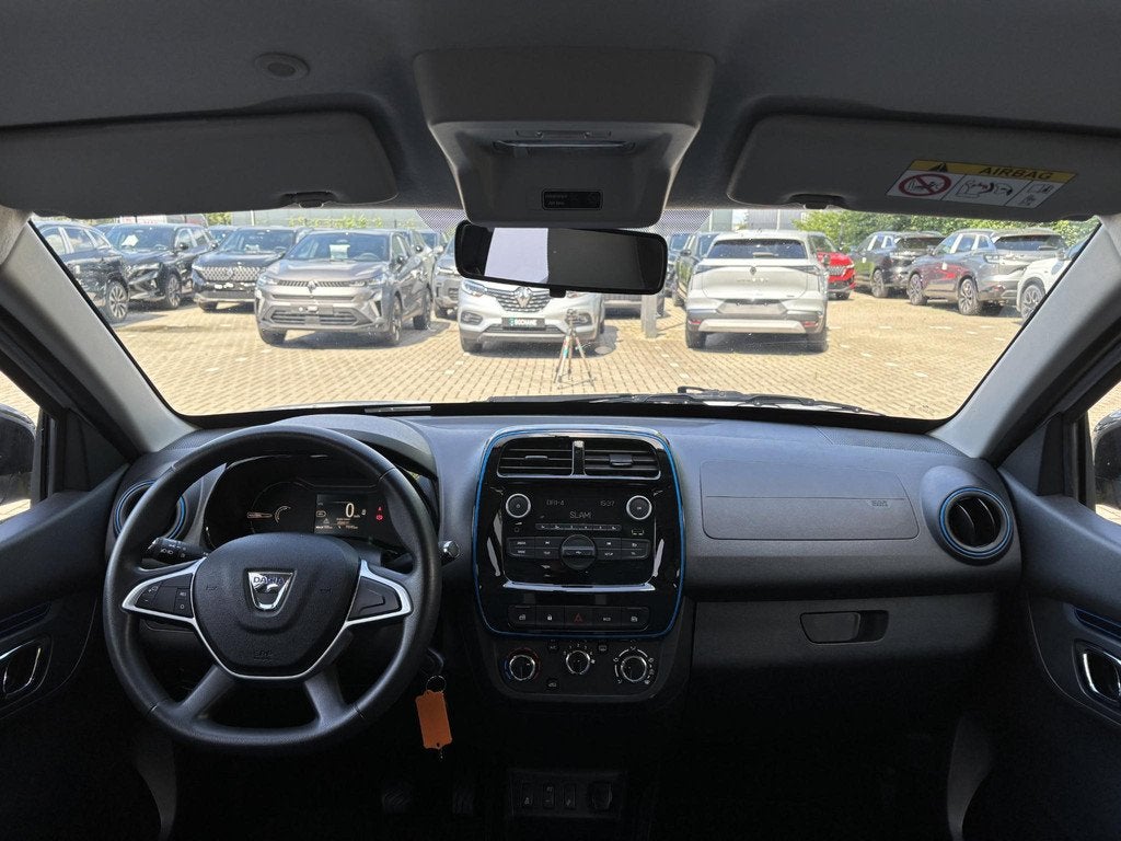 Dacia Spring Comfort 27 kWh | 1e Eigenaar | Airco |, Auto's, Dacia, Gebruikt, Leder en Stof, Wit, Te koop