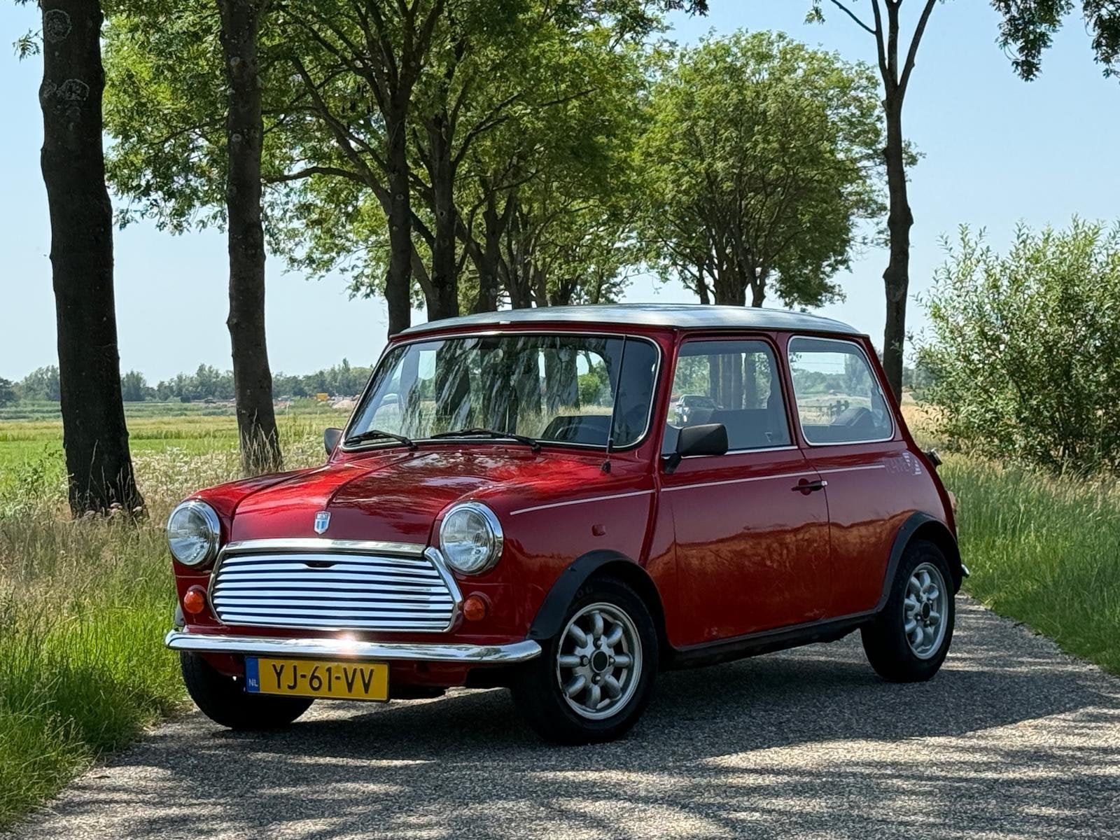 Mini 1000 Flame Red Origineel NL, Auto's, Voorwielaandrijving, Stof, Zwart, 4 cilinders