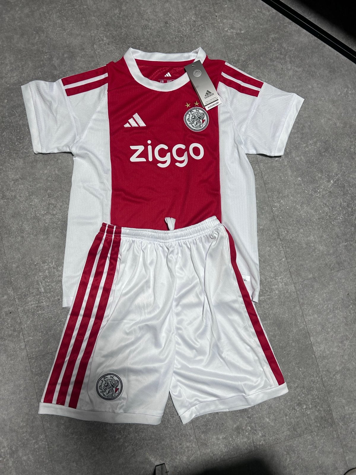 Ajax thuistenue 2026/2027 voor kids - Maat 146, Kinderen en Baby's, Kinderkleding | Maat 146, Verzenden, Nieuw, Jongen of Meisje
