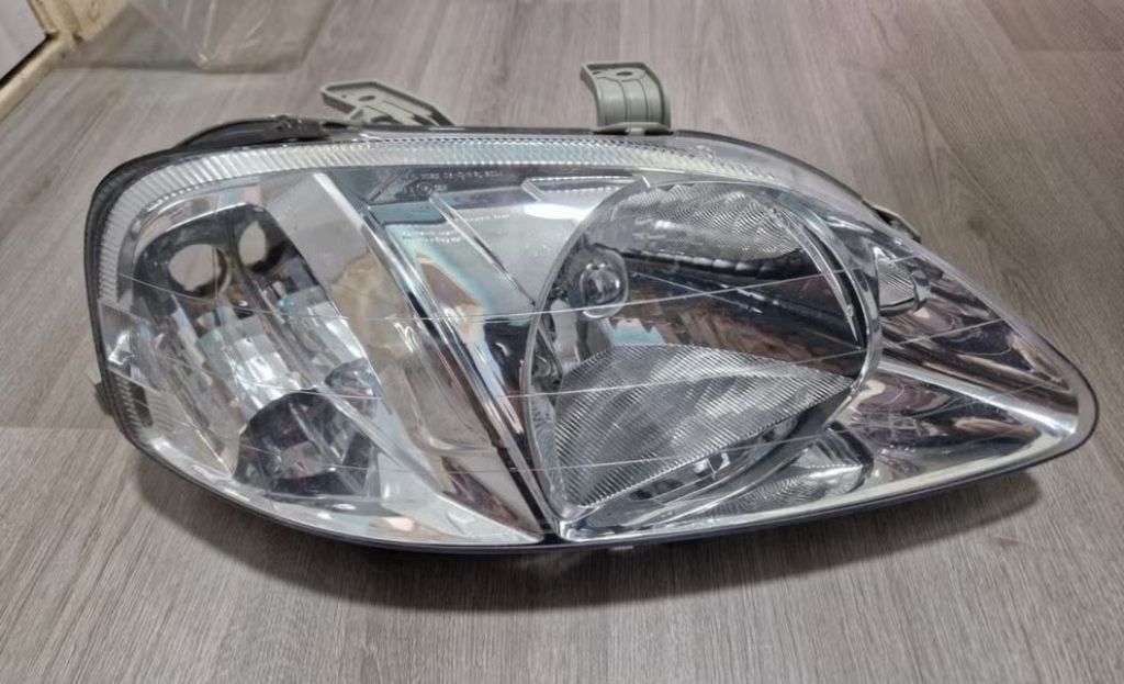 Nieuwe originele koplamp Honda Civic EK 1999-2000 facelift, Ophalen of Verzenden, Nieuw, Honda