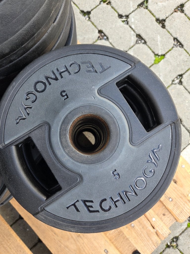 Technogym PU Urethane halterschijven - diverse gewichten, Sport en Fitness, Ophalen, Gebruikt, Benen, Halterschijven