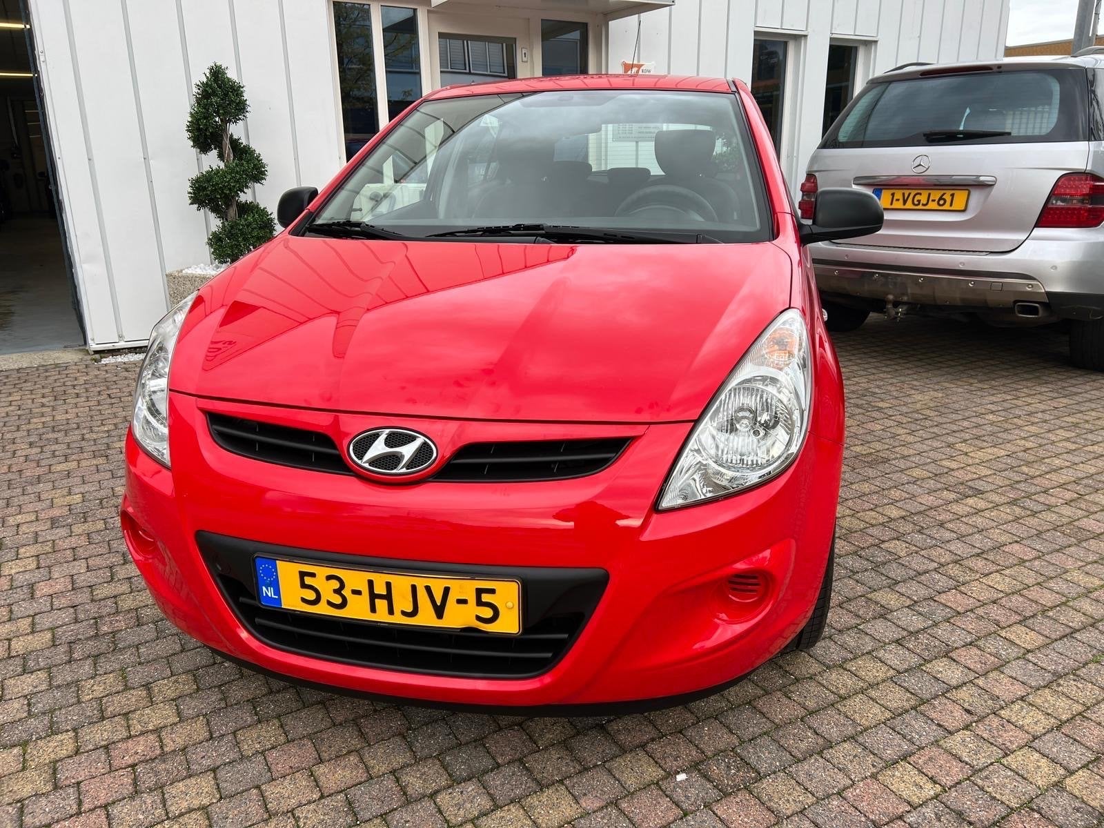 Hyundai i20 1.2 5-DRS 2008 Rood, Auto's, 31 €/maand, 4 cilinders, Origineel Nederlands, Handgeschakeld