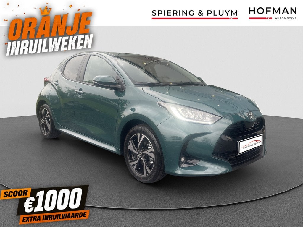 Toyota Yaris 1.5 Hybrid 115 Dynamic 10jr garantie (bj 2025), Stof, Nieuw, Hybride Elektrisch/Benzine, 3 cilinders