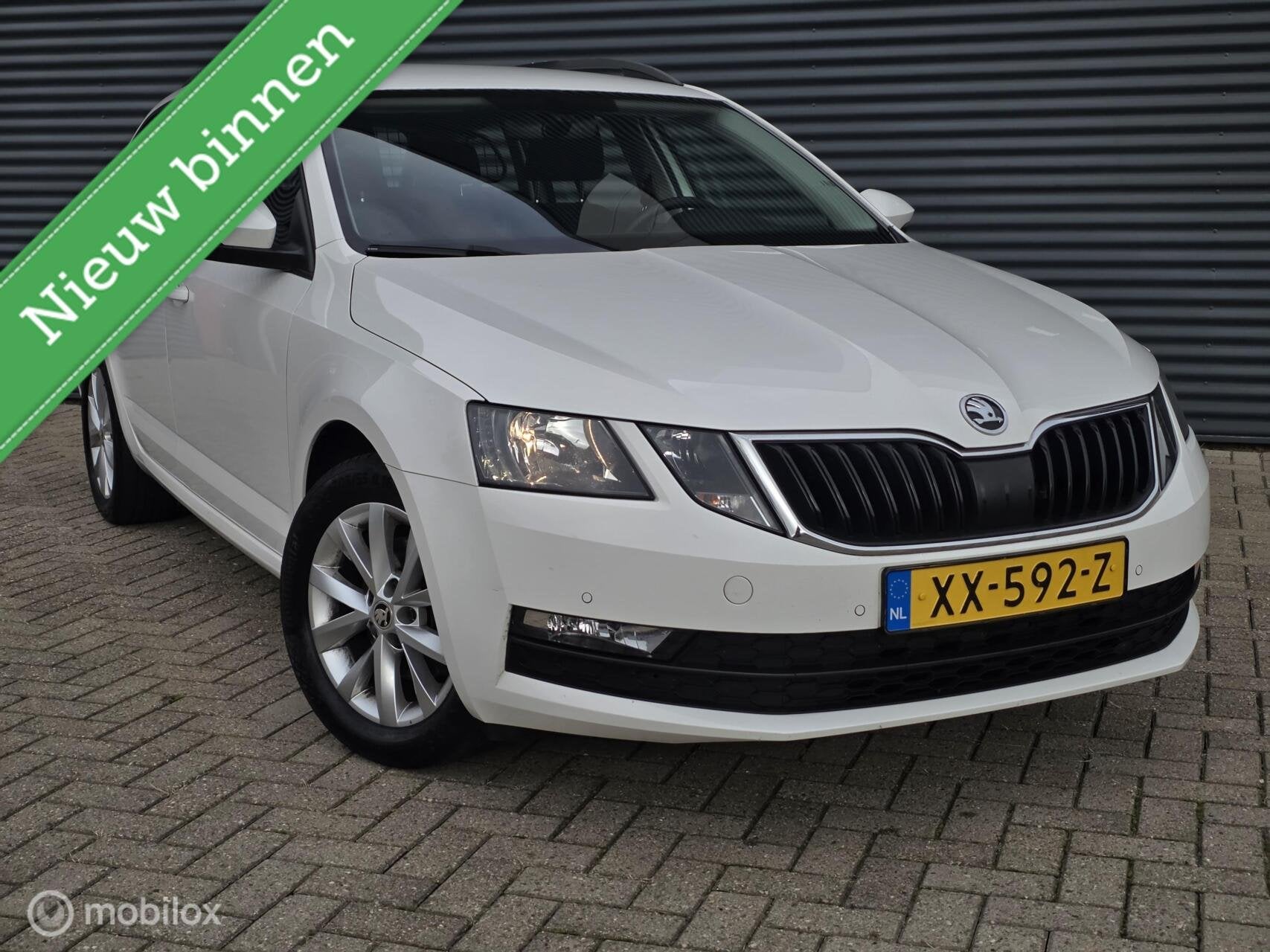 Skoda Octavia Combi 1.0 TSI Greentech Ambition Business, Auto's, Gebruikt, Euro 6, Met garantie (alle), Parkeersensor