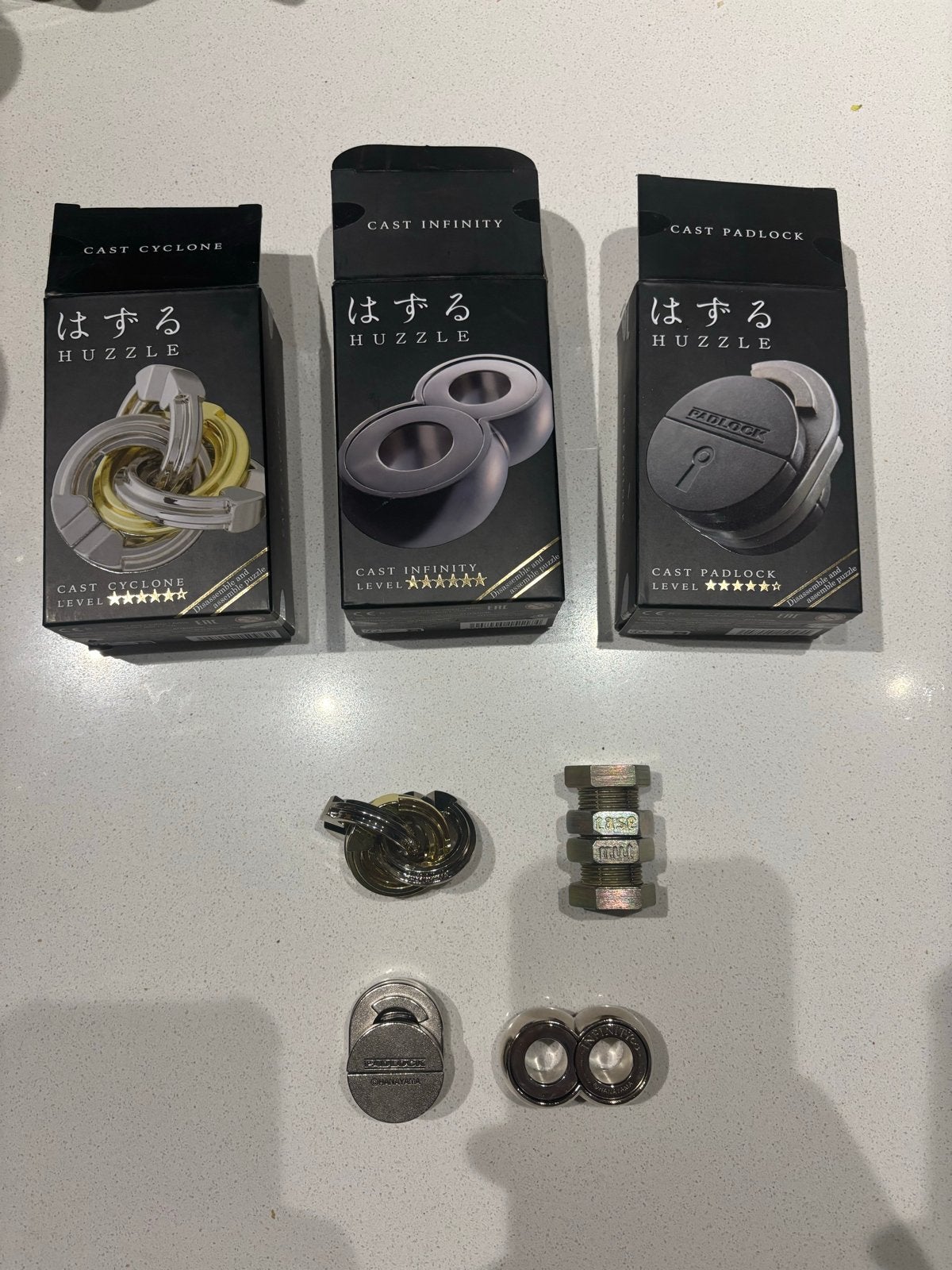 Hanayama Huzzle Puzzle: Cyclone, Infinity, Padlock & Nutcase, Ophalen of Verzenden, Minder dan 500 stukjes, Zo goed als nieuw