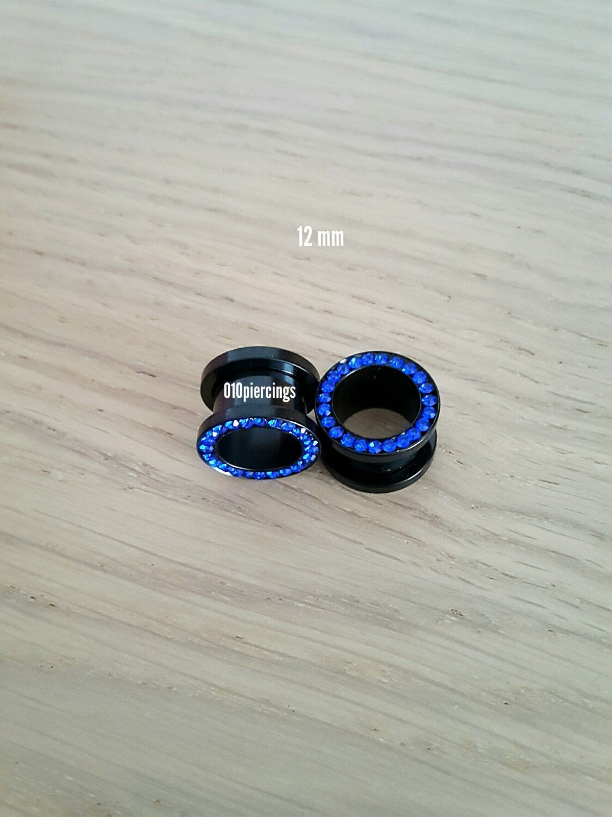 Nieuwe tunnels, pluggen. Staal. Zwart. Blauwe steentjes., Sieraden, Tassen en Uiterlijk, Piercings, Ophalen of Verzenden, Zo goed als nieuw