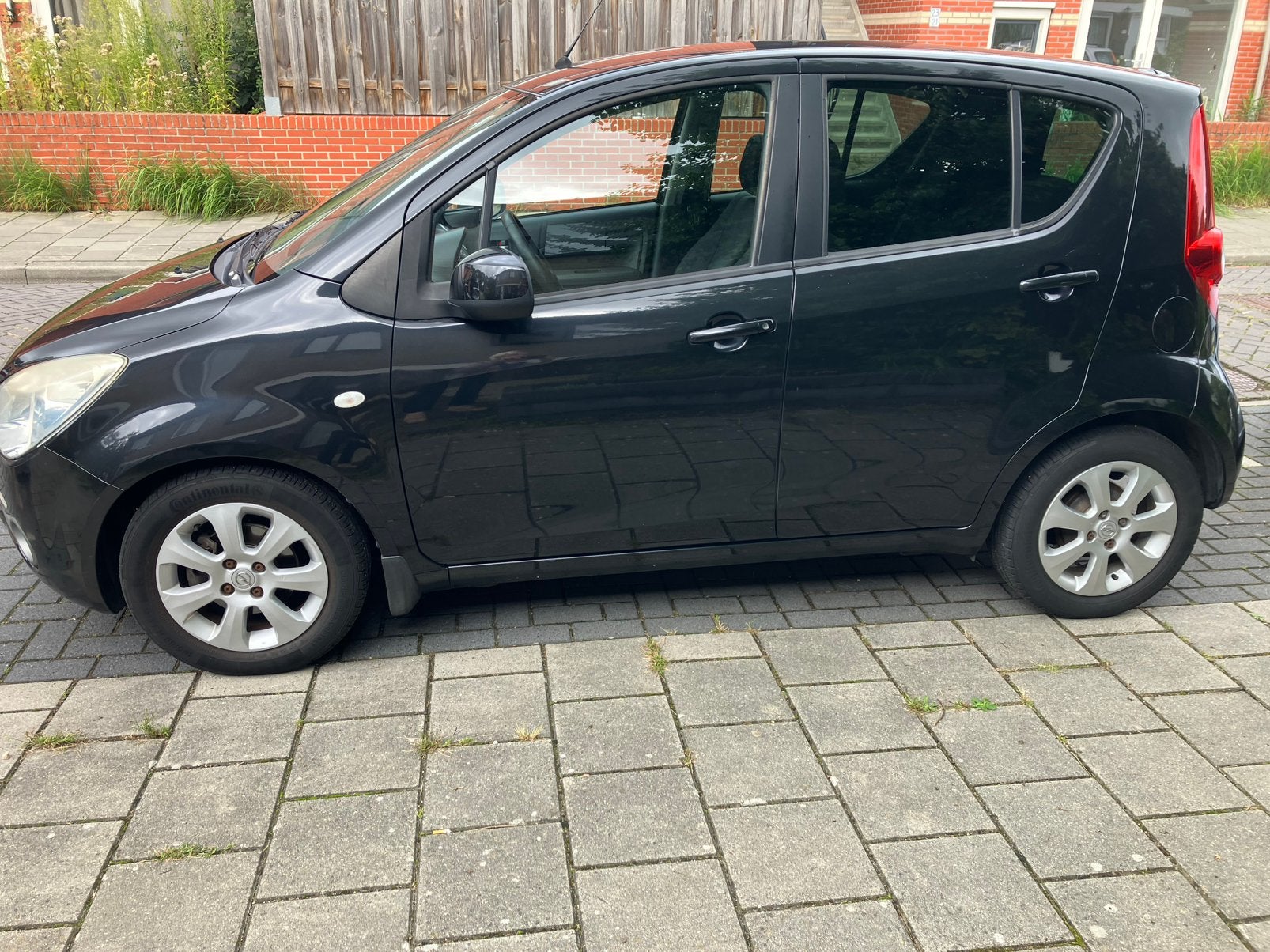 Opel Agila 1.2 16V AUT 2009 Zwart, Auto's, Euro 5, Stof, 4 cilinders, Zwart