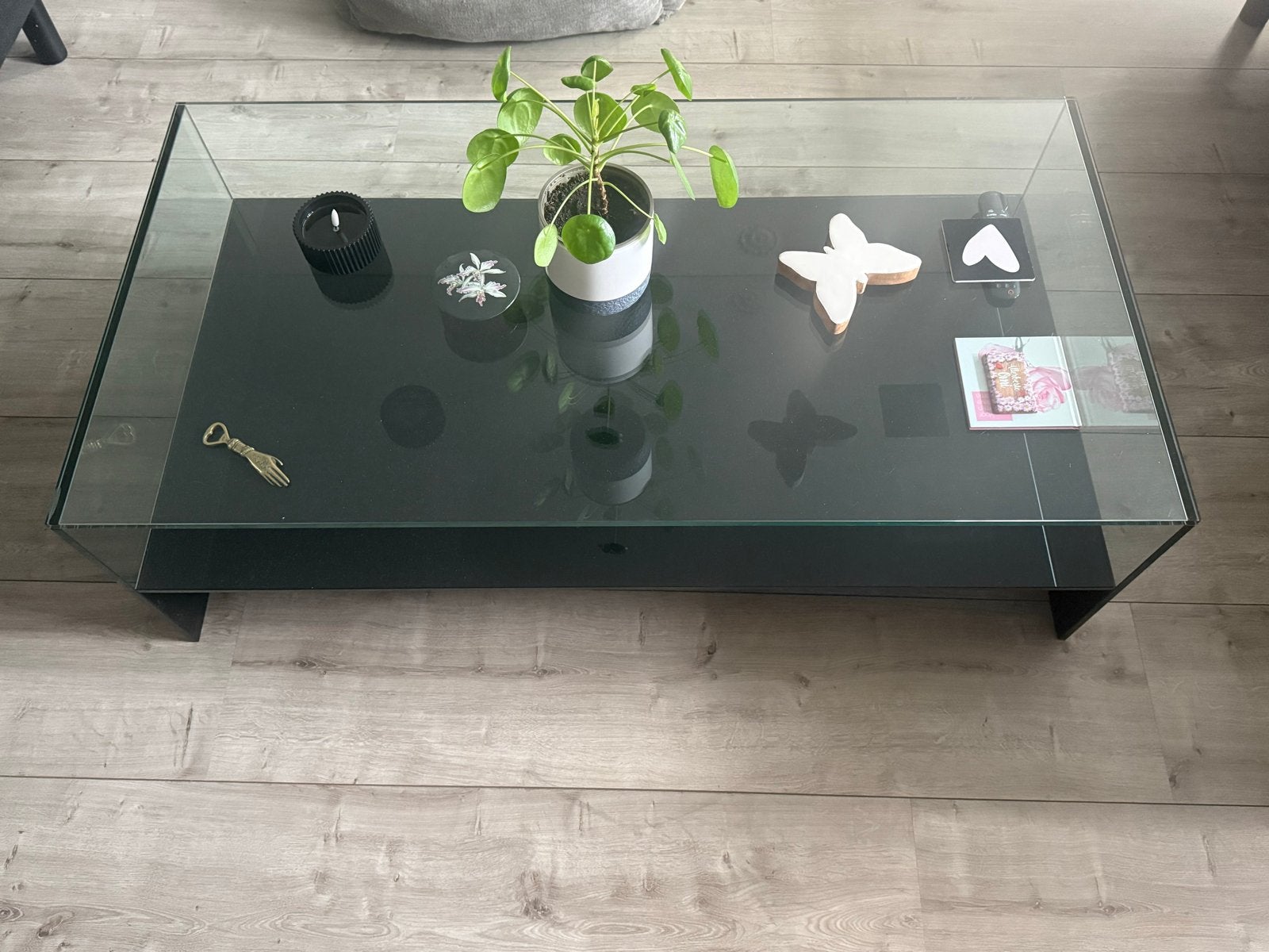 Glazen salontafel met zwart onderblad, Ophalen, Gebruikt, 100 tot 150 cm, 50 tot 100 cm