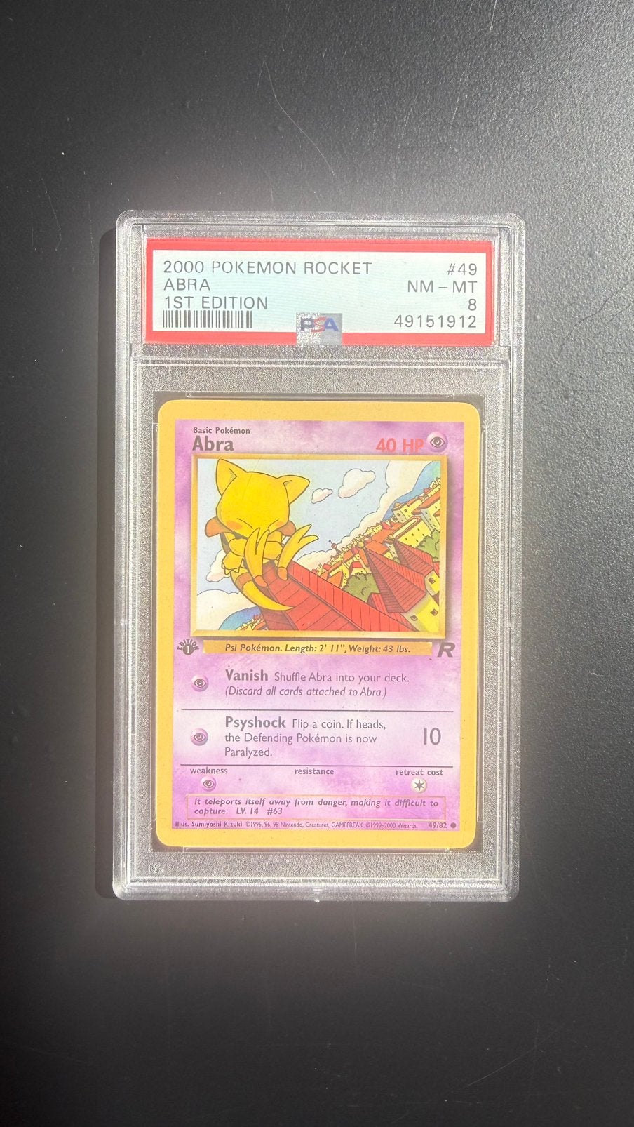 2000 Pokemon Rocket Abra 1st Edition PSA8, Ophalen of Verzenden, Zo goed als nieuw