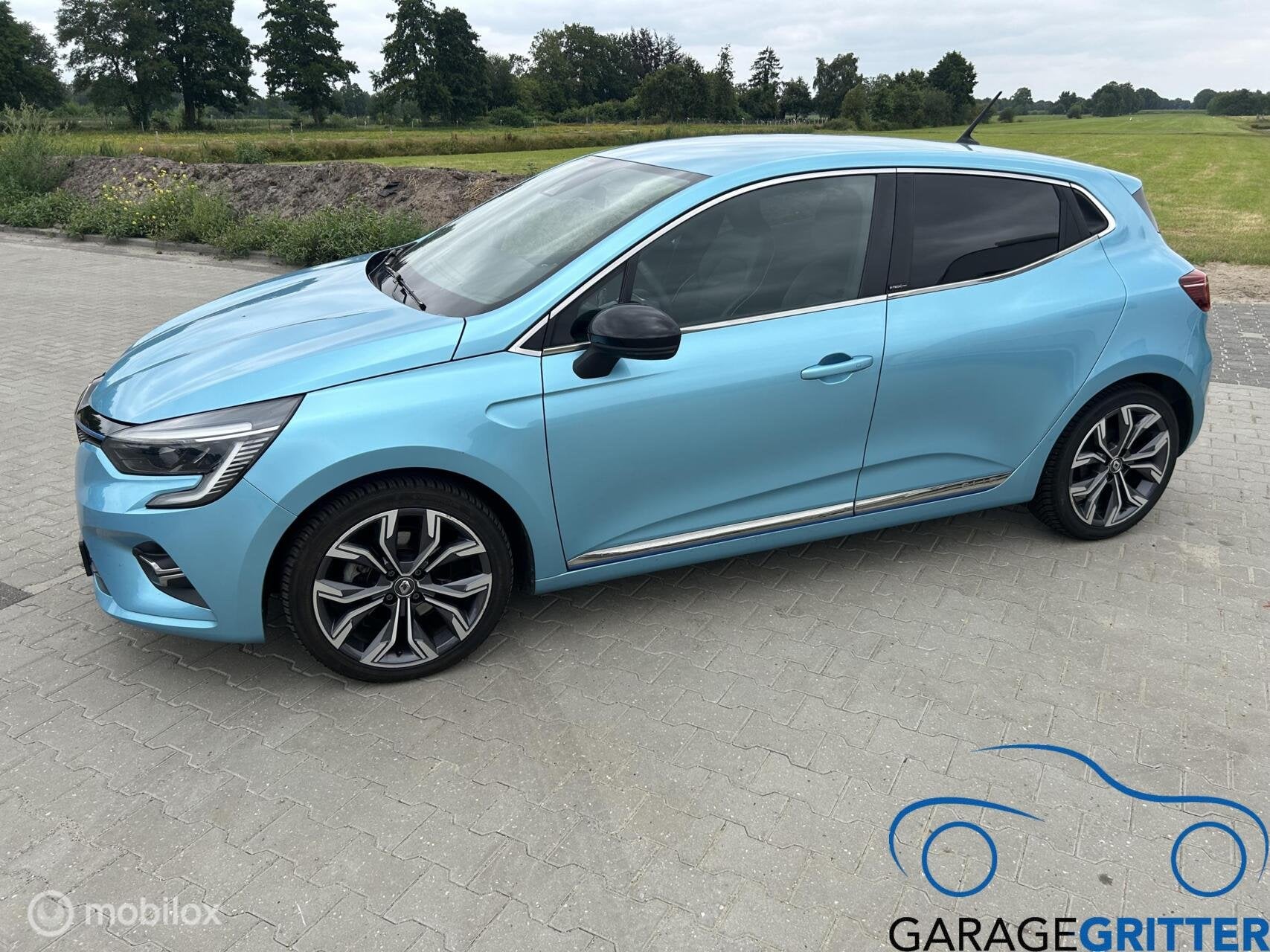 Renault Clio 1.6 E-Tech Hybrid 140 Intens, Auto's, Gebruikt, Euro 6, 4 cilinders, Blauw