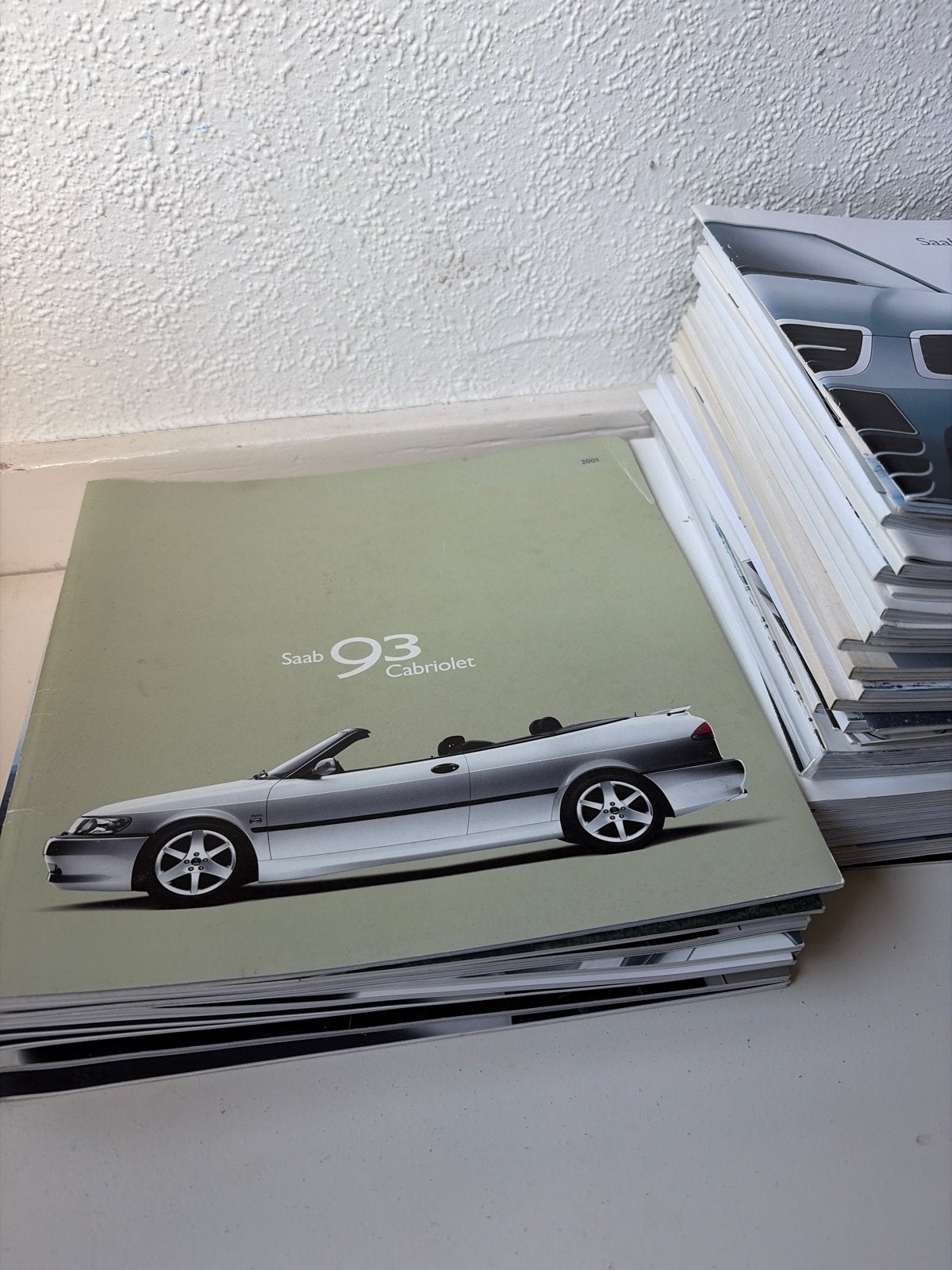 Stapel Saab folders - Diverse modellen en jaren, Ophalen of Verzenden, Gelezen