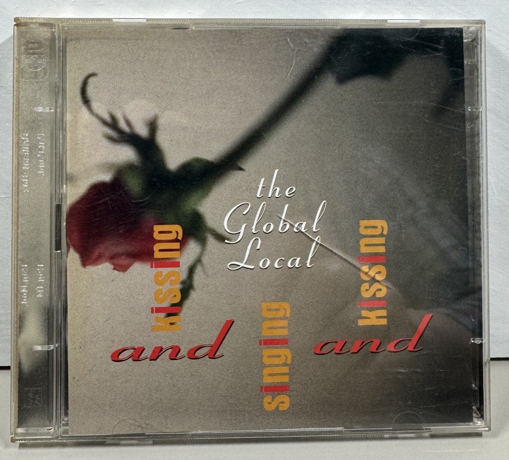 CD - The Global Local - Kissing and Singing and Kissing, Inclusief boekje, Gebruikt, Ophalen of Verzenden, Album