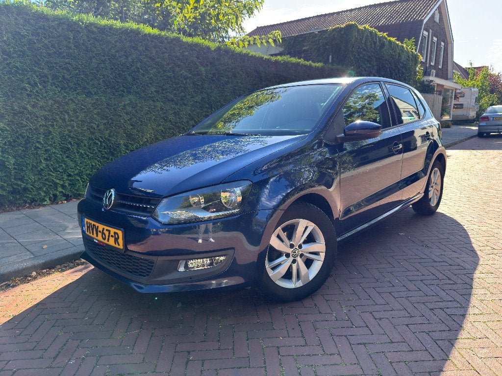 Volkswagen Polo 1.2 Comfortline 51KW 2011 Blauw, Auto's, Voorwielaandrijving, Euro 5, Zwart, Blauw